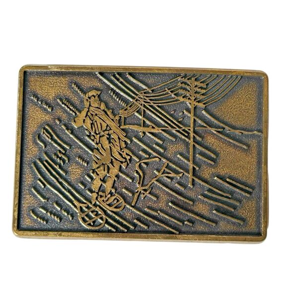 Vintage Electric Power Lineman in Snowshoes‎ Snow Storm Brass Belt Buckle 1970's - Picture 1 of 8